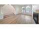 Open living space featuring new flooring, a fireplace, and abundant natural light at 4664 Stuttgart St, Las Vegas, NV 89147