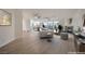 Open concept living area with wood flooring, fireplace and large windows for ample natural light at 4664 Stuttgart St, Las Vegas, NV 89147
