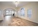 Spacious open living area with a fireplace, large windows, and neutral walls at 4664 Stuttgart St, Las Vegas, NV 89147