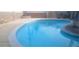 Large in-ground pool with blue water, concrete patio and landscaping surrounding the property at 5178 Wilbur St, Las Vegas, NV 89119