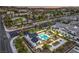 This aerial view shows the community pool and nearby houses at 545 Thea St # 1315, Henderson, NV 89052