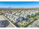 Beautiful aerial view showcasing modern townhomes, desert landscaping, and a stunning mountain backdrop at 545 Thea St # 1315, Henderson, NV 89052