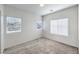 This bedroom has neutral carpet and multiple bright windows at 545 Thea St # 1315, Henderson, NV 89052