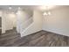 Dining area with a modern chandelier and staircase leading to the upper level at 545 Thea St # 1315, Henderson, NV 89052