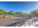 Community entrance gate with brick pillars and mature landscaping at 545 Thea St # 1315, Henderson, NV 89052