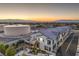 Stunning dusk view of townhomes with mountain backdrop, showcasing modern design and desert landscaping at 545 Thea St # 1315, Henderson, NV 89052