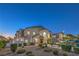 Well-maintained townhomes with green spaces and park benches at 545 Thea St # 1315, Henderson, NV 89052