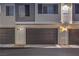 Modern townhome garages with address numbers and exterior lighting at 545 Thea St # 1315, Henderson, NV 89052