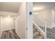 Hallway view, steps leading upstairs, and a thermostat on the wall at 545 Thea St # 1315, Henderson, NV 89052