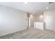 Bright hallway with neutral carpet and white walls leading to other rooms in the house at 545 Thea St # 1315, Henderson, NV 89052
