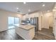 Modern kitchen featuring a center island, stainless steel appliances and sliding glass doors at 545 Thea St # 1315, Henderson, NV 89052