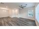 Bright living room with wood floors, ceiling fan and fresh neutral paint at 545 Thea St # 1315, Henderson, NV 89052