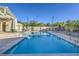 A community pool features sun loungers and covered seating at 545 Thea St # 1315, Henderson, NV 89052