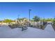 Community pool and recreation area with seating and shade structures at 545 Thea St # 1315, Henderson, NV 89052