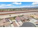 Aerial view showcases a neighborhood featuring single-story homes with tile roofs and desert landscaping at 5505 Verbena Creek Ct, Las Vegas, NV 89131