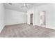 Bright bedroom with neutral carpet, a ceiling fan, and a closet at 5505 Verbena Creek Ct, Las Vegas, NV 89131