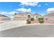 Charming single-story home featuring a two-car garage, tidy landscaping, and a welcoming facade at 5505 Verbena Creek Ct, Las Vegas, NV 89131