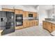 Kitchen featuring stainless appliances, light wood cabinets, and tile flooring at 5505 Verbena Creek Ct, Las Vegas, NV 89131