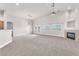 Spacious living area featuring high ceilings, fresh paint, fireplace, and French doors at 5505 Verbena Creek Ct, Las Vegas, NV 89131