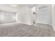 Bright living room showcasing fresh paint, neutral carpet, and plenty of natural light at 5505 Verbena Creek Ct, Las Vegas, NV 89131
