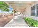 Covered patio provides an inviting outdoor space, complete with a pergola and manicured landscaping at 5505 Verbena Creek Ct, Las Vegas, NV 89131