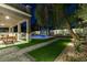Serene backyard featuring a pool, covered patio, and beautifully landscaped garden at 5573 San Florentine Ave, Las Vegas, NV 89141