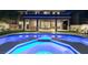 Backyard with a refreshing pool, spa, covered patio, and lush green lawn at 5573 San Florentine Ave, Las Vegas, NV 89141