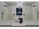Modern bathroom with a freestanding tub, dual shower heads, and sleek fixtures at 5573 San Florentine Ave, Las Vegas, NV 89141