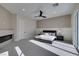 Bright bedroom featuring a ceiling fan, fireplace, and sliding glass doors to welcome the morning sun at 5573 San Florentine Ave, Las Vegas, NV 89141
