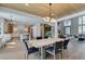Dining room with wood-look ceiling, open to kitchen and living room at 5573 San Florentine Ave, Las Vegas, NV 89141