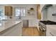 Modern kitchen with stainless steel appliances, quartz counters, and open shelving at 5573 San Florentine Ave, Las Vegas, NV 89141