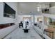 Bright and open living space featuring a fireplace and staircase at 5573 San Florentine Ave, Las Vegas, NV 89141