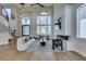 Stylish living room with modern decor, fireplace, and staircase at 5573 San Florentine Ave, Las Vegas, NV 89141