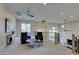 Spacious loft area features two black leather chairs, modern lighting, and carpeted floors at 5573 San Florentine Ave, Las Vegas, NV 89141