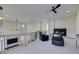 A stylish upstairs loft with contemporary decor, a fireplace, and carpet flooring at 5573 San Florentine Ave, Las Vegas, NV 89141