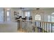 Bright loft with a unique chandelier, decorative railing and views of the exterior at 5573 San Florentine Ave, Las Vegas, NV 89141