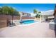 Backyard with a sparkling pool and spa, covered patio area, perfect for outdoor relaxation and entertaining at 5600 Old Stable Ave, Las Vegas, NV 89131