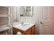 Well-lit bathroom features a vanity with storage and a mirrored cabinet at 5600 Old Stable Ave, Las Vegas, NV 89131