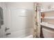 Bright bathroom with a white shower-tub combination and patterned shower curtain at 5600 Old Stable Ave, Las Vegas, NV 89131