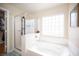 Clean bathroom with a separate shower and tub at 5600 Old Stable Ave, Las Vegas, NV 89131