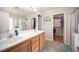 Spacious bathroom features double sinks, walk-in shower, tub, and a walk-in closet at 5600 Old Stable Ave, Las Vegas, NV 89131