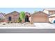 Charming home with a two-car garage and a well-maintained xeriscaped front yard at 5600 Old Stable Ave, Las Vegas, NV 89131