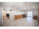 Spacious kitchen has tile floors, and shares space with dining area and access to the outdoor pool at 5600 Old Stable Ave, Las Vegas, NV 89131