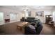 Spacious living room with natural light, neutral color scheme, and view of the entry at 5600 Old Stable Ave, Las Vegas, NV 89131