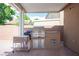 Outdoor kitchen with built-in grill and cooler, perfect for backyard gatherings at 5600 Old Stable Ave, Las Vegas, NV 89131