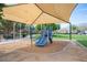 Neighborhood playground with slides, swings, and shade, providing a fun and safe play area at 5600 Old Stable Ave, Las Vegas, NV 89131