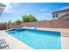 Inviting pool with a basketball hoop, attached spa, and ample space for entertaining in this backyard at 5600 Old Stable Ave, Las Vegas, NV 89131