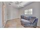 Bright bonus room with a comfortable chair and natural light at 6 Montana Way, Henderson, NV 89015