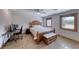 Bright bedroom with a queen bed, desk, and natural light from the windows at 6 Montana Way, Henderson, NV 89015