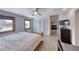 Sunlit bedroom featuring a queen-sized bed, closet, and stylish decor at 6 Montana Way, Henderson, NV 89015